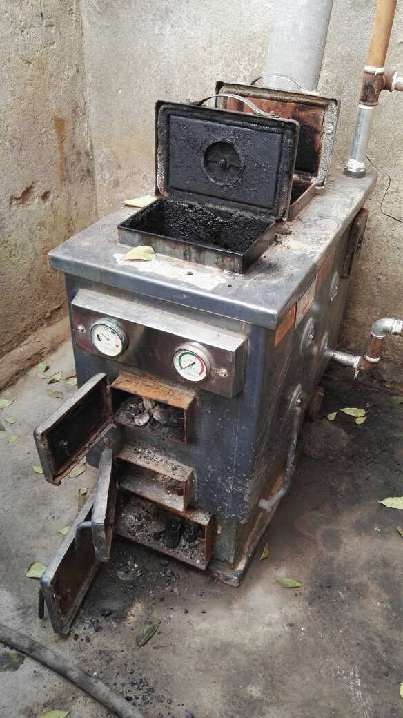 反烧锅炉如何正确使用这是我家的炉子,反烧的,二百六十平米的,但是煤