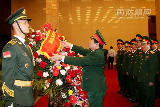 The Secretary of defense to the Chairman Mao Memorial Hall and a basket of flowers to their
