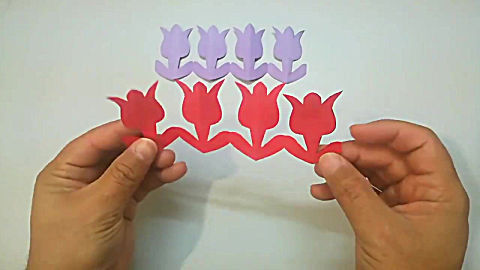 剪纸教程,教你用彩纸剪出连串的花朵