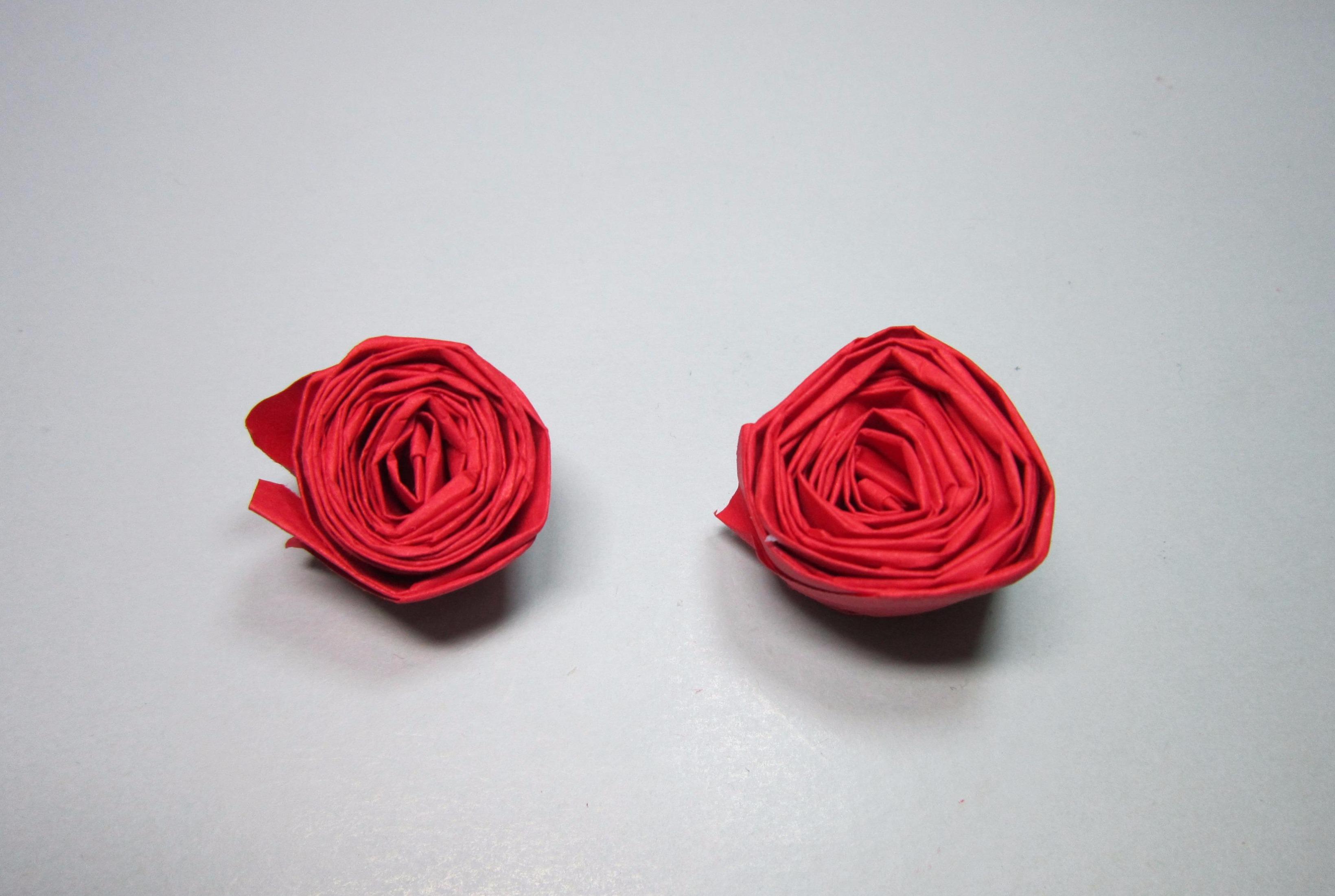 视频:儿童手工折纸玫瑰花,简单的将纸条卷起来就是一朵美丽的玫瑰花了