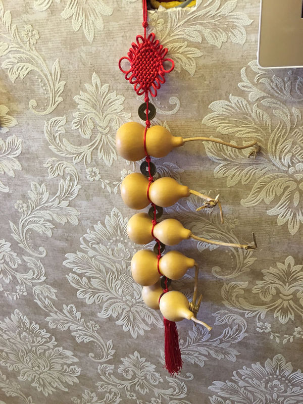 新房装修完,婆婆给买了一串葫芦 适合挂在哪里?请说的详细一些